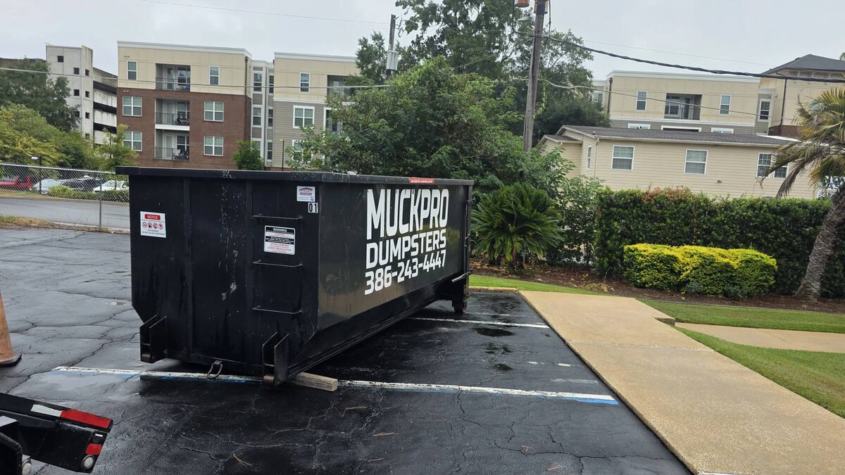 Muckpro roll-off dumpster placed at a commercial site in Tallahassee, Florida
