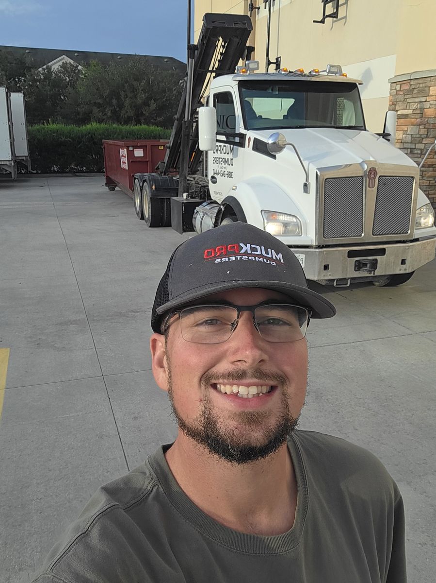 Darrell Sparks, Muckpro owner, on an evening emergency dumpster delivery in Gainesville