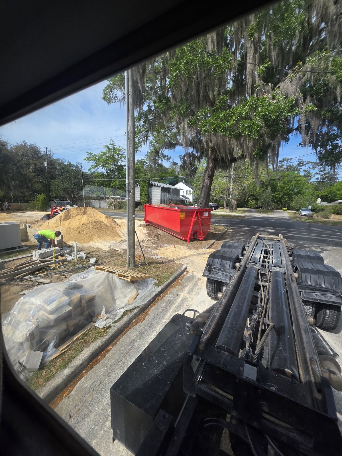 Muckpro roll-off dumpster delivered to a Gainesville FL new construction site