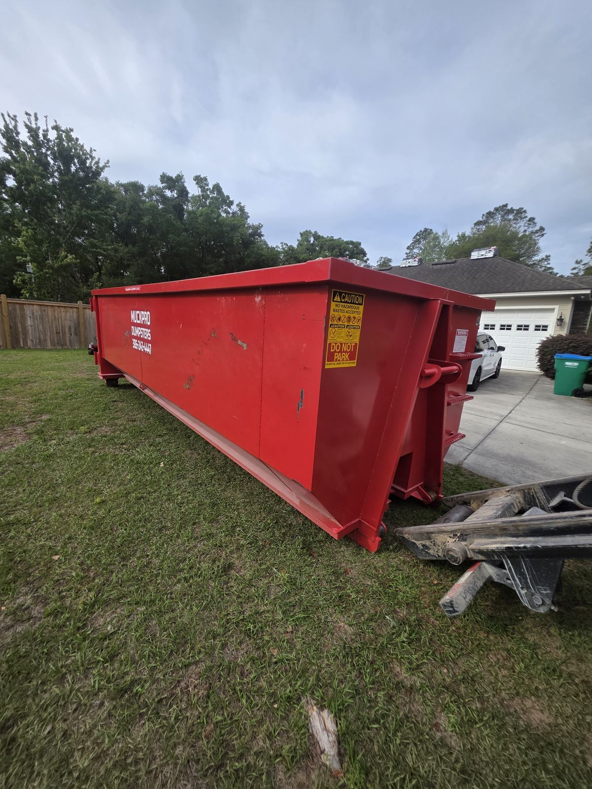 Muckpro 40 yard dumpster staged for a reroof at a High Springs FL home