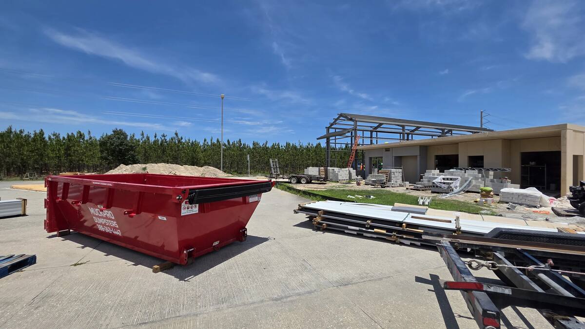 Muckpro roll-off on a highway weigh station construction site in North Florida