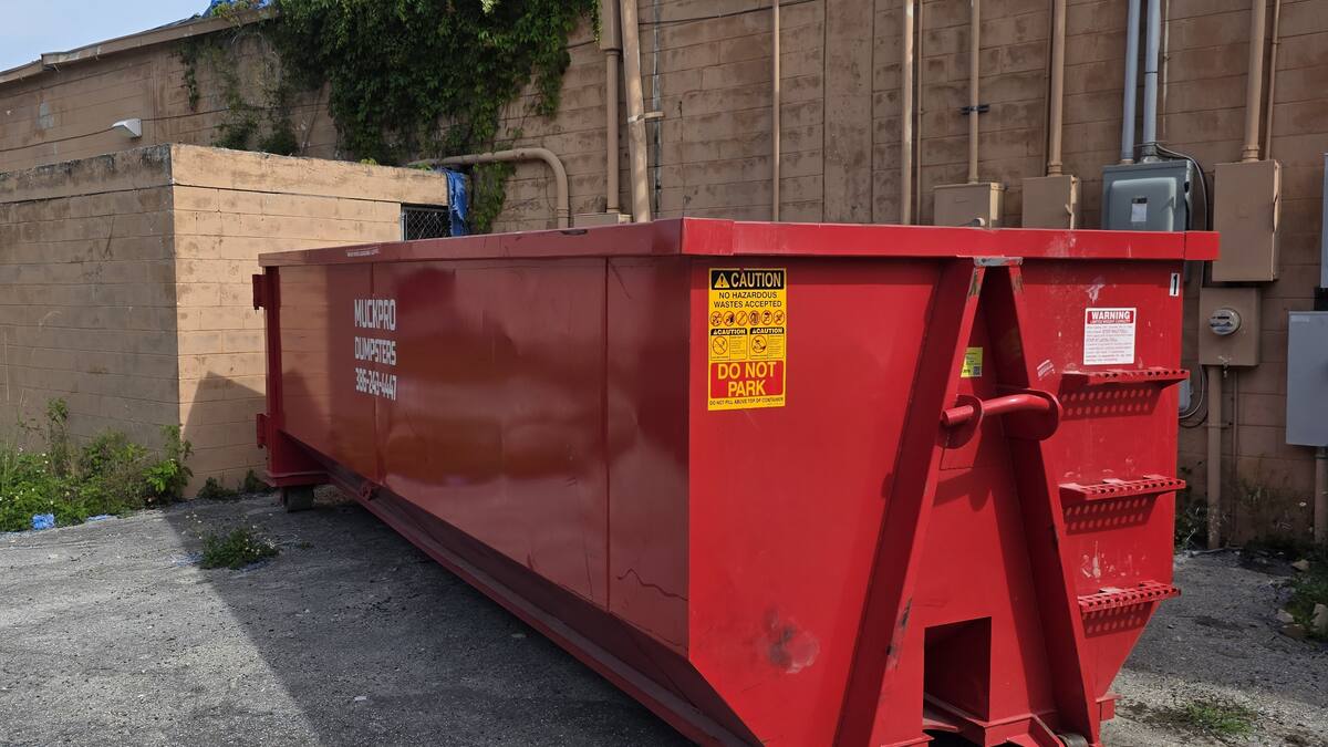 Muckpro 30-yard dumpster on a downtown Live Oak, Florida job