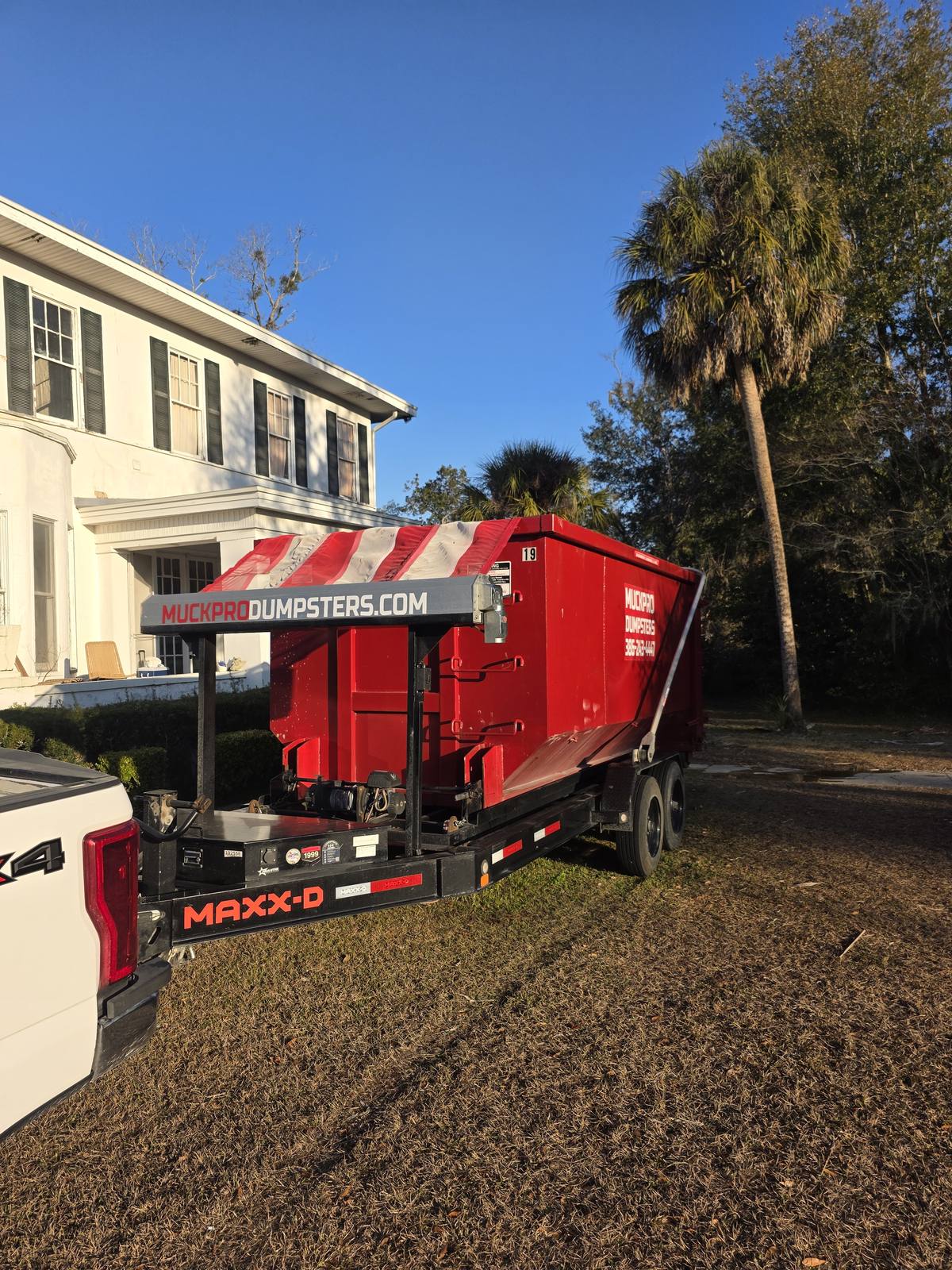 Muckpro trailer dumpster at a historic Madison FL home estate cleanout