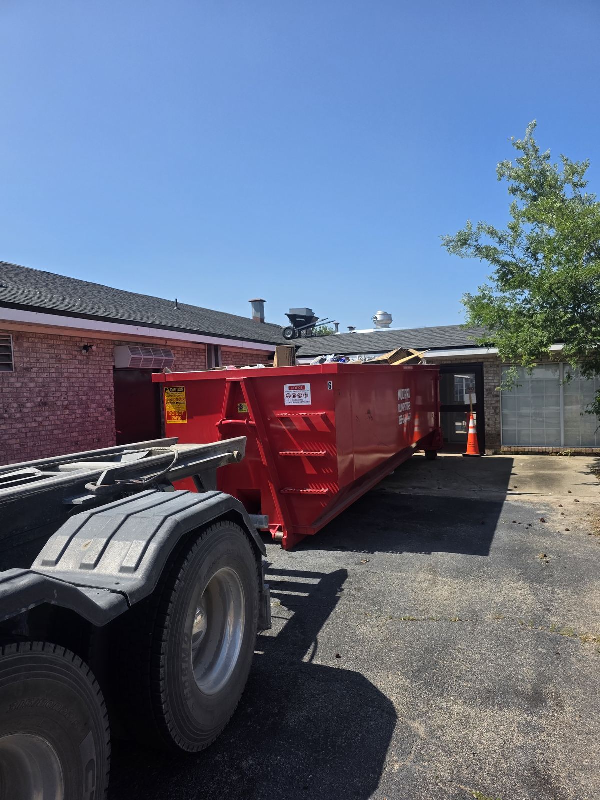 Loaded Muckpro dumpster at a Madison FL commercial kitchen renovation