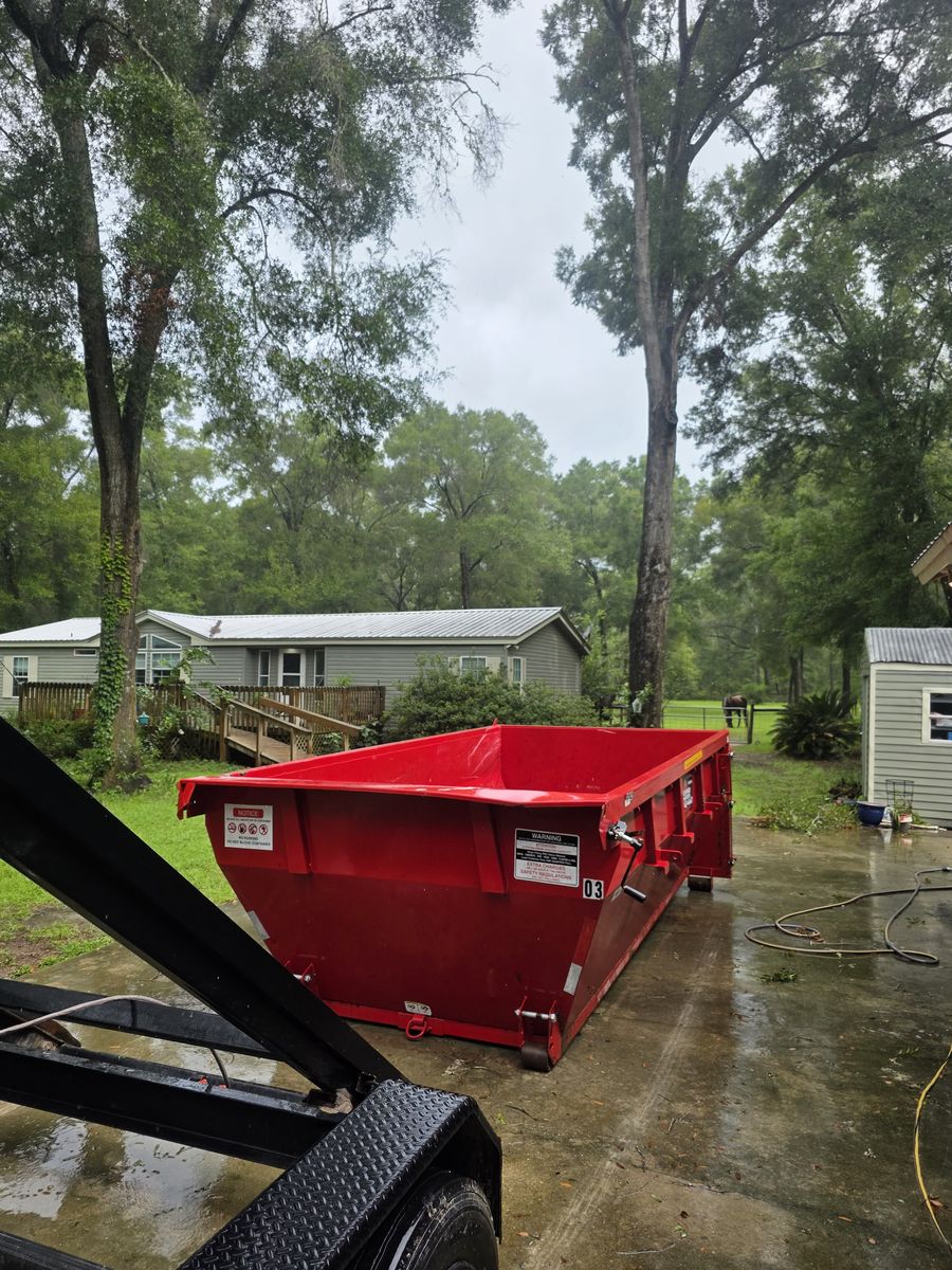 Muckpro roll-off dumpster delivered to a Newberry FL home