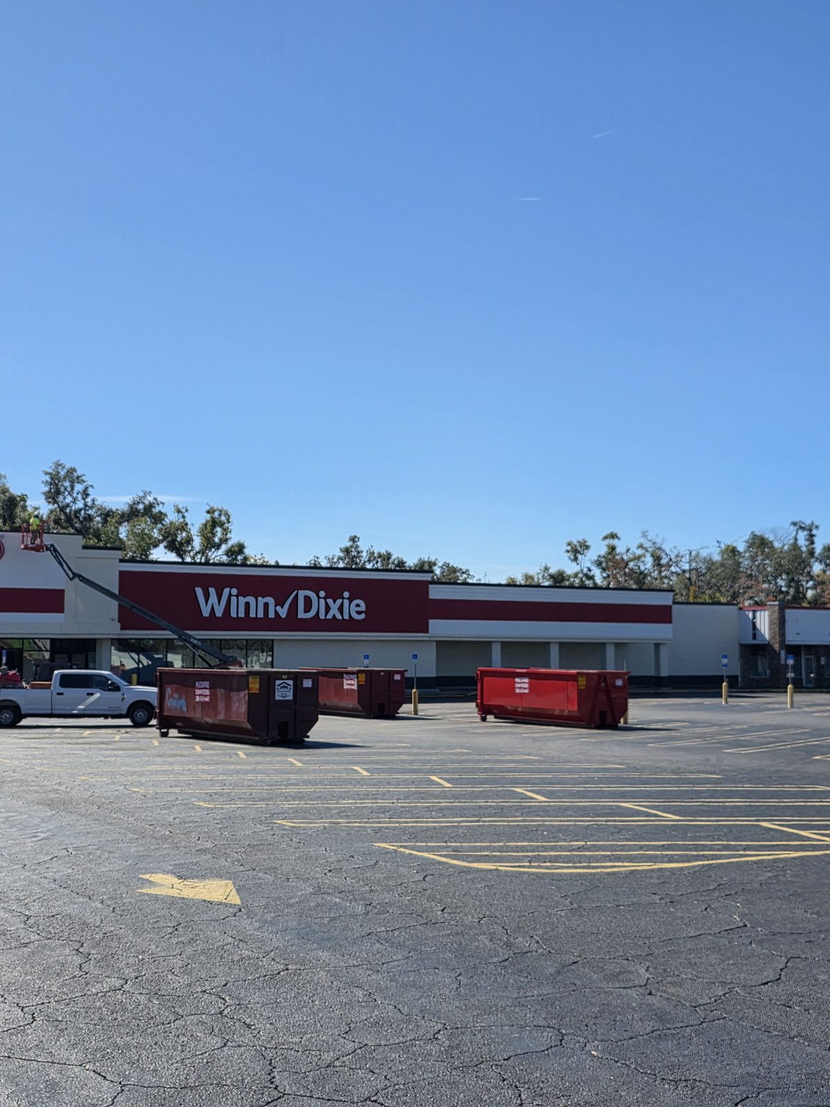 Multiple roll-off dumpsters staged at a Perry FL commercial renovation