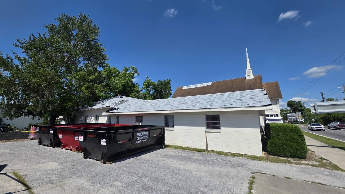 Three Muckpro dumpsters staged for a church roof replacement in Mayo, Florida