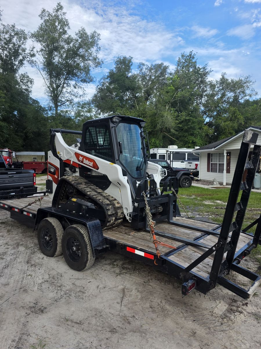 Bobcat T66 compact track loader loaded and chained for a Muckpro customer rental