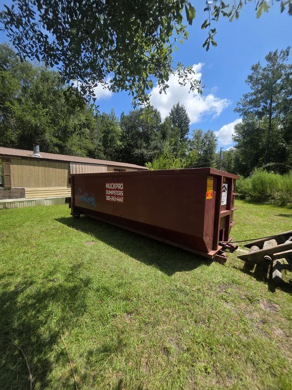 30-yard Muckpro dumpster loaded on a demolition job